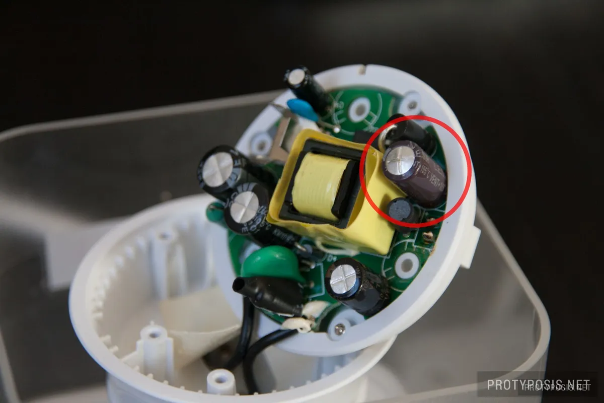 7a) Remove power board by pushing against the two pins of the power plug and replace the capacitor