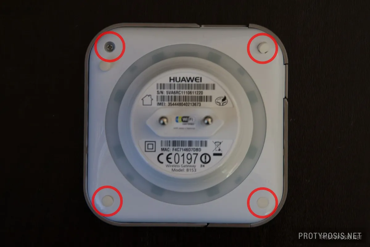 2) Remove 4 rubber plugs and screws